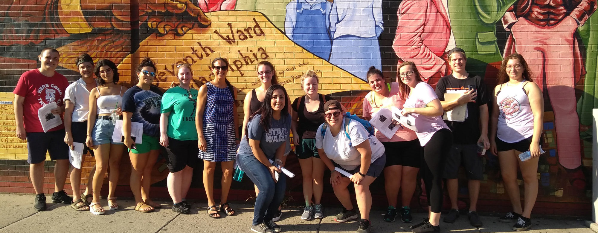 Students in front of mural